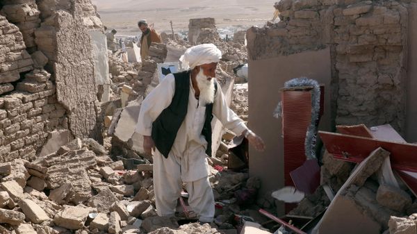 A man cleans up after an earthquake in Zenda Jan district in Herat province, of western Afghanistan, Sunday, Oct. 8, 2023. - Sputnik International