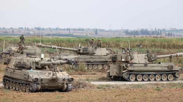 Israeli army soldiers are positioned with their armoured vehicles near the border with the Gaza Strip in southern Israel on October 9, 2023.  - Sputnik International