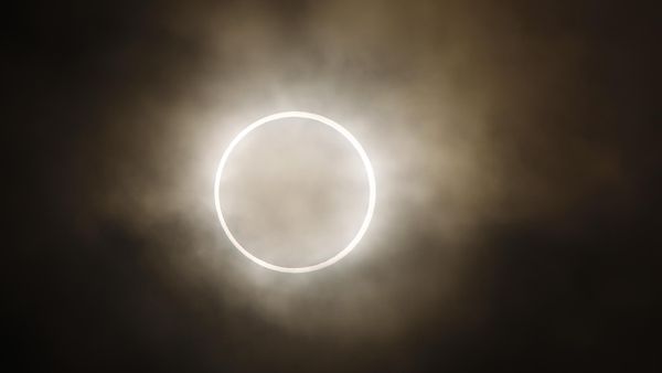 An annular eclipse appears at a waterfront park in Yokohama, near Tokyo, Monday, May 21, 2012.  Tens of millions in the Americas will have front-row seats Saturday, Oct. 7, 2023 for a “ring of fire” eclipse of the sun. What's called an annular solar eclipse _ better known as a ring of fire _ will briefly dim the skies over sections of the western U.S. and Central and South America on Saturday.  - Sputnik International