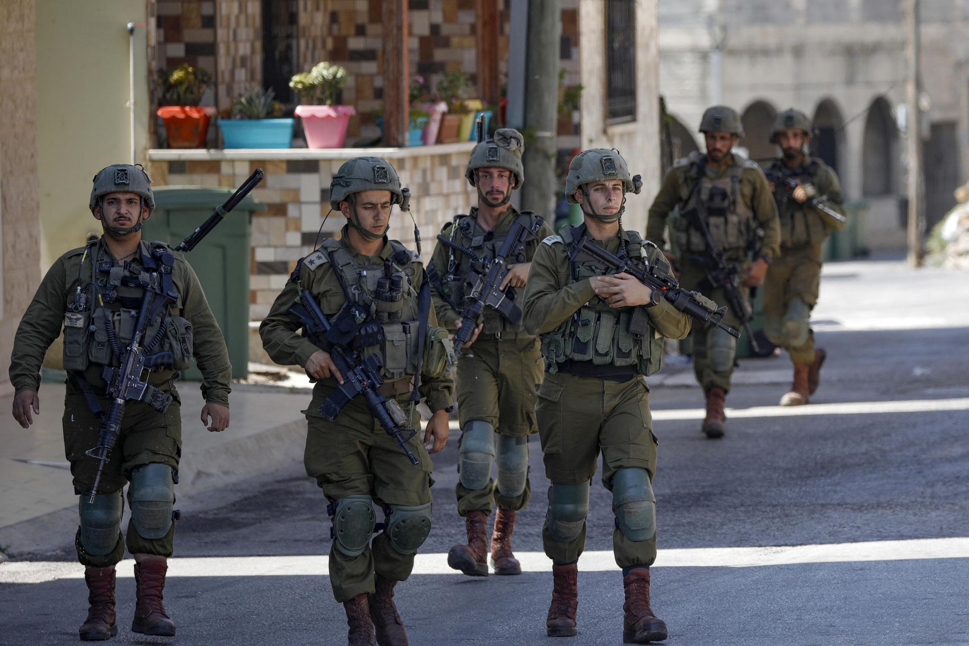 Israeli soldiers patrol the town of Ghajar in the occupied Golan Heights bordering Lebanon on July 6, 2023.  - Sputnik International, 1920, 10.10.2023