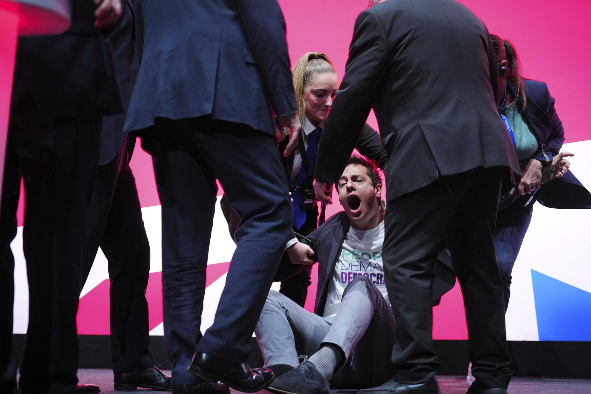 An unidentified man is carried away by security guards from the stage after thrown confetti to the Britain's opposition Labour Party leader Keir Starmer during his speech at the Labour Party conference in Liverpool, England, Tuesday, Oct. 10, 2023. An unidentified man is carried away by security guards from the stage after thrown confetti to the Britain's opposition Labour Party leader Keir Starmer during his speech at the Labour Party conference in Liverpool, England, Tuesday, Oct. 10, 2023. - Sputnik International, 1920, 10.10.2023