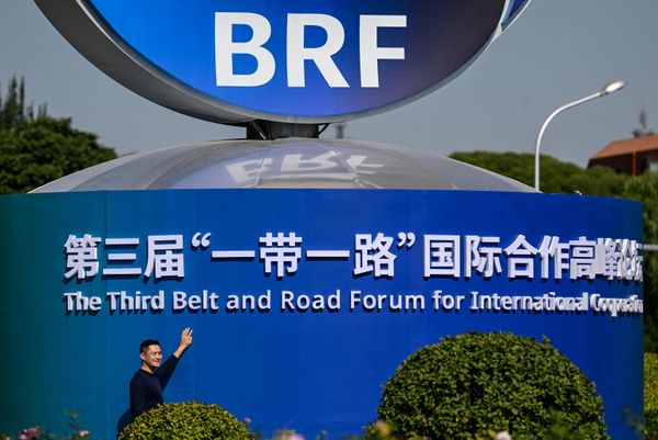 A man poses next to an installation of the Third Belt and Road Forum for Int'l Cooperation in Beijing.  - Sputnik International