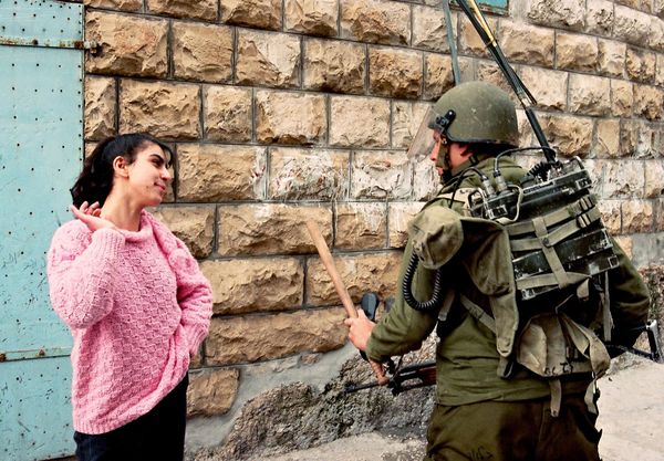 A Palestinian girl talks to an Israeli soldier on February 28, 1988, in Bet Sahur after the Israeli army had entered the village near Bethlehem following violent demonstration.The Palestinian uprising, often referred to as the intifada, was a sustained period of Palestinian protests and resistance against Israeli occupation in the West Bank, Gaza Strip, and East Jerusalem. It began in December 1987 and continued until 1993 when the Oslo peace accords were signed.The intifada was sparked by a combination of factors, including frustration with Israeli occupation, economic hardship, political grievances, and a desire for self-determination. The intifada was characterized by a variety of forms of protest and resistance, including mass demonstrations, strikes, civil disobedience, and the use of stones as weapons. The term "war of stones" refers to the practice of Palestinian youths throwing stones at Israeli soldiers and military vehicles.It was not uncommon during the intifada for Israeli forces to enter Palestinian towns and villages, like Bet Sahur, in response to protests, often resulting in clashes.The intifada lasted for several years, during which time it had a profound impact on the Palestine-Israel conflict. It led to significant changes in the political landscape and eventually contributed to the initiation of peace talks.The intifada continued until 1993 when the Oslo peace accords were signed between Israel and the PLO, and laid the groundwork for subsequent negotiations. A Palestinian girl talks to an Israeli soldier on February 28, 1988, in Bet Sahur after the Israeli army had entered the village near Bethlehem following violent demonstration.The Palestinian uprising, often referred to as the intifada, was a sustained period of Palestinian protests and resistance against Israeli occupation in the West Bank, Gaza Strip, and East Jerusalem. It began in December 1987 and continued until 1993 when the Oslo peace accords were signed.The intifada was sparked by a combination of factors, including frustration with Israeli occupation, economic hardship, political grievances, and a desire for self-determination. The intifada was characterized by a variety of forms of protest and resistance, including mass demonstrations, strikes, civil disobedience, and the use of stones as weapons. The term "war of stones" refers to the practice of Palestinian youths throwing stones at Israeli soldiers and military vehicles.It was not uncommon during the intifada for Israeli forces to enter Palestinian towns and villages, like Bet Sahur, in response to protests, often resulting in clashes.The intifada lasted for several years, during which time it had a profound impact on the Palestine-Israel conflict. It led to significant changes in the political landscape and eventually contributed to the initiation of peace talks.The intifada continued until 1993 when the Oslo peace accords were signed between Israel and the PLO, and laid the groundwork for subsequent negotiations. - Sputnik International