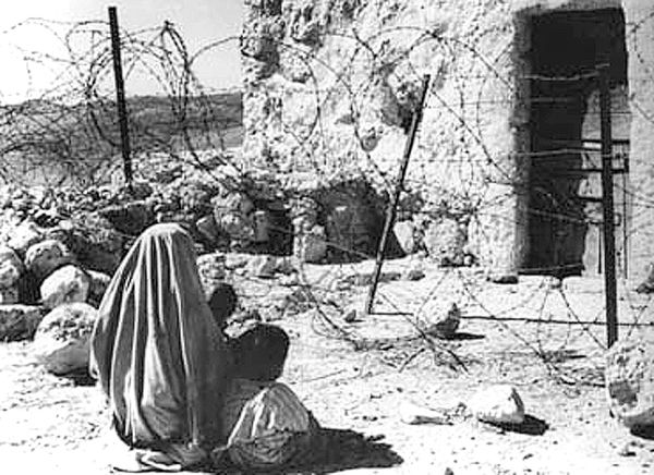 This picture dated 1948 shows a Palestinian woman refugee and her child separated from their home by the Green Line after the 1948 war.The Green Line was the armistice line established in 1949 at the end of the 1948 Arab-Israeli War, also known as the War of Independence. It played a significant role in shaping the geopolitical landscape of Israel and the Palestinian territories. The Line became a result of armistice agreements negotiated between Israel and its neighboring Arab states, including Egypt, Jordan, Syria, and Lebanon. These agreements were brokered by the United Nations and were intended to bring a temporary halt to hostilities and create a demarcation line separating the warring parties. The armistice agreements were signed between February and July 1949, effectively ending the major combat operations of the 1948 war. The Green Line was established during this period, and it marked the de facto borders between Israel and the neighboring Arab states at that time. The Green Line was not a permanent border or an internationally recognized boundary. It was simply a demarcation line, often drawn on maps in green ink, to represent the position of Israeli and Arab forces at the time the armistice agreements were signed.The Line divided the former British Mandate of Palestine into two main areas: Israel on one side and the West Bank (controlled by Jordan) and the Gaza Strip (controlled by Egypt) on the other. This division had a profound impact on the future of the Israeli-Palestinian conflict.The border's line became a central point of reference in subsequent negotiations and discussions regarding the Israeli-Palestinian conflict. It played a role in defining the borders of Israel following its declaration of statehood in 1948 and was the starting point for discussions about the status of Palestinian territories in the years that followed. Palestinians commemorate 14 May the 50th anniversary of the "Nakba" ['catastrophe', in Arabic) marking the creation of Israel and the exodus of 700 000 Palestinian refugees from their land.The Green Line represents a physical reminder of the displacement and division caused by the 1948 war. It still exists in historical and political contexts, but is not a recognized international border. This picture dated 1948 shows a Palestinian woman refugee and her child separated from their home by the Green Line after the 1948 war.The Green Line was the armistice line established in 1949 at the end of the 1948 Arab-Israeli War, also known as the War of Independence. It played a significant role in shaping the geopolitical landscape of Israel and the Palestinian territories. The Line became a result of armistice agreements negotiated between Israel and its neighboring Arab states, including Egypt, Jordan, Syria, and Lebanon. These agreements were brokered by the United Nations and were intended to bring a temporary halt to hostilities and create a demarcation line separating the warring parties. The armistice agreements were signed between February and July 1949, effectively ending the major combat operations of the 1948 war. The Green Line was established during this period, and it marked the de facto borders between Israel and the neighboring Arab states at that time. The Green Line was not a permanent border or an internationally recognized boundary. It was simply a demarcation line, often drawn on maps in green ink, to represent the position of Israeli and Arab forces at the time the armistice agreements were signed.The Line divided the former British Mandate of Palestine into two main areas: Israel on one side and the West Bank (controlled by Jordan) and the Gaza Strip (controlled by Egypt) on the other. This division had a profound impact on the future of the Israeli-Palestinian conflict.The border's line became a central point of reference in subsequent negotiations and discussions regarding the Israeli-Palestinian conflict. It played a role in defining the borders of Israel following its declaration of statehood in 1948 and was the starting point for discussions about the status of Palestinian territories in the years that followed. Palestinians commemorate 14 May the 50th anniversary of the "Nakba" ['catastrophe', in Arabic) marking the creation of Israel and the exodus of 700 000 Palestinian refugees from their land.The Green Line represents a physical reminder of the displacement and division caused by the 1948 war. It still exists in historical and political contexts, but is not a recognized international border. - Sputnik International