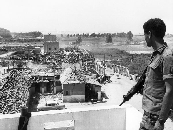 An Israeli soldier watches Palestinian refugees crossing the war-wretched Allenby Bridge to reach the east bank of Jordan 22 June 1967. The June 1967 war was a stunning military victory for Israel, but the start of a political stalemate that continues to this day. During the Six-Day War Israel suffered around 700 fatalities, while estimates of the numbers of Arabs killed range from just over 11,000 to 21,000, with losing the Egyptians paying the heaviest tribute. Israel was left in control of the Sinai, the Gaza Strip, the West Bank and East Jerusalem, as well as the Golan Heights. Some 350,000 Palestinians fled the newly occupied regions to take up residence in neighboring states. Most of them have never been able to return, and are still living in refugee camps. An Israeli soldier watches Palestinian refugees crossing the war-wretched Allenby Bridge to reach the east bank of Jordan 22 June 1967. The June 1967 war was a stunning military victory for Israel, but the start of a political stalemate that continues to this day. During the Six-Day War Israel suffered around 700 fatalities, while estimates of the numbers of Arabs killed range from just over 11,000 to 21,000, with losing the Egyptians paying the heaviest tribute. Israel was left in control of the Sinai, the Gaza Strip, the West Bank and East Jerusalem, as well as the Golan Heights. Some 350,000 Palestinians fled the newly occupied regions to take up residence in neighboring states. Most of them have never been able to return, and are still living in refugee camps. - Sputnik International