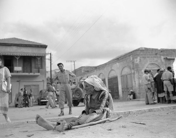 An old Arab woman, caring little of the fortunes of the war in Palestine, sits in the dust of the industrial main street in the Negev coastal town of El Majdal, Nov. 13, 1948. She is one of 2,000 Arabs that remained after its Egyptian garrison retreated before Jewish occupation forces arrived. She remained because she had nowhere to go and no means to get there. El Majdal had a population of about 7,000.The Egyptian troops were stationed in the town of El Majdal (now known as Ashkelon) in the Negev region during the 1948 Arab-Israeli War. The Egyptian garrison was present in El Majdal as part of the broader Arab military intervention in the 1948 war. When the State of Israel was established in May 1948, neighboring Arab states, including Egypt, sent troops to support Palestinian Arabs and oppose the newly formed Israeli state. The Egyptian garrison in El Majdal was part of this military effort to protect Arab interests and to oppose Israeli forces in the region. An old Arab woman, caring little of the fortunes of the war in Palestine, sits in the dust of the industrial main street in the Negev coastal town of El Majdal, Nov. 13, 1948. She is one of 2,000 Arabs that remained after its Egyptian garrison retreated before Jewish occupation forces arrived. She remained because she had nowhere to go and no means to get there. El Majdal had a population of about 7,000.The Egyptian troops were stationed in the town of El Majdal (now known as Ashkelon) in the Negev region during the 1948 Arab-Israeli War. The Egyptian garrison was present in El Majdal as part of the broader Arab military intervention in the 1948 war. When the State of Israel was established in May 1948, neighboring Arab states, including Egypt, sent troops to support Palestinian Arabs and oppose the newly formed Israeli state. The Egyptian garrison in El Majdal was part of this military effort to protect Arab interests and to oppose Israeli forces in the region. - Sputnik International