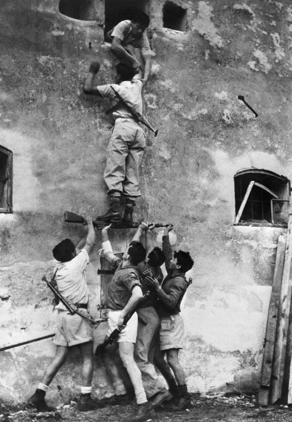 Haganah fighters scale a house in June 1948 in Tel Aviv.The Haganah was a Jewish paramilitary organization that operated in British Mandate Palestine from the early 1920s until the establishment of the State of Israel in 1948.The Haganah, which means "Defense" in Hebrew, was founded in 1920 as a self-defense organization by Jewish residents of Palestine during the period of British rule.The Haganah was created in response to the increasing violence and tensions between Jewish and Arab communities in Palestine during the early 20th century. The Arab riots of 1920 and 1921 highlighted the vulnerability of Jewish communities, leading to the formation of the Haganah to provide protection.The primary goal of the Haganah was to defend Jewish communities in British Mandate Palestine against various threats, including Arab violence, as well as to prepare for the eventual establishment of a Jewish state. While its primary focus was on self-defense, it also played a role in illegal immigration and clandestine arms acquisition.The Haganah engaged in a wide range of activities, including training its members, acquiring weapons, and establishing intelligence networks. It also cooperated with other Jewish underground organizations, such as the Irgun and Lehi, during the struggle for Jewish statehood.With the establishment of the State of Israel in 1948, the Haganah transitioned into the Israel Defense Forces (IDF), becoming the core of Israel's military establishment. Many former Haganah members became key figures in Israel's military and political leadership.Its legacy lives on in the history of Israel and its role in the struggle for statehood. The IDF, in essence, carries on the traditions and functions of the Haganah as the military of the State of Israel. The Haganah played a pivotal role in the establishment of Israel and the defense of Jewish communities during a critical period in the nation's history. Haganah fighters scale a house in June 1948 in Tel Aviv.The Haganah was a Jewish paramilitary organization that operated in British Mandate Palestine from the early 1920s until the establishment of the State of Israel in 1948.The Haganah, which means "Defense" in Hebrew, was founded in 1920 as a self-defense organization by Jewish residents of Palestine during the period of British rule.The Haganah was created in response to the increasing violence and tensions between Jewish and Arab communities in Palestine during the early 20th century. The Arab riots of 1920 and 1921 highlighted the vulnerability of Jewish communities, leading to the formation of the Haganah to provide protection.The primary goal of the Haganah was to defend Jewish communities in British Mandate Palestine against various threats, including Arab violence, as well as to prepare for the eventual establishment of a Jewish state. While its primary focus was on self-defense, it also played a role in illegal immigration and clandestine arms acquisition.The Haganah engaged in a wide range of activities, including training its members, acquiring weapons, and establishing intelligence networks. It also cooperated with other Jewish underground organizations, such as the Irgun and Lehi, during the struggle for Jewish statehood.With the establishment of the State of Israel in 1948, the Haganah transitioned into the Israel Defense Forces (IDF), becoming the core of Israel's military establishment. Many former Haganah members became key figures in Israel's military and political leadership.Its legacy lives on in the history of Israel and its role in the struggle for statehood. The IDF, in essence, carries on the traditions and functions of the Haganah as the military of the State of Israel. The Haganah played a pivotal role in the establishment of Israel and the defense of Jewish communities during a critical period in the nation's history. - Sputnik International