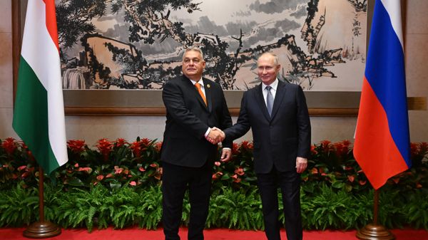 Hungarian Prime Minister Viktor Orban and Russian President Vladimir Putin shake hands before their meeting as part of the 3rd Belt and Road Forum at the Diaoyutai State Guest House in Beijing, China - Sputnik International