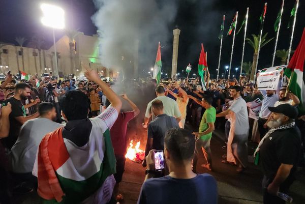 Crowds burn an American flag during a protest in Libya's capital, Tripoli, late on October 17, 2023, in support of the Palestinians following the missile strike on Gaza's Ahli Arab hospital which killed hundreds. Israel and the Palestinians have traded blame for the incident.  - Sputnik International