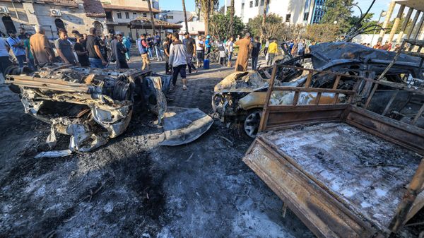 People search through debris outside the site of the Ahli Arab hospital in central Gaza on October 18, 2023 in the aftermath of an overnight strike there. - Sputnik International