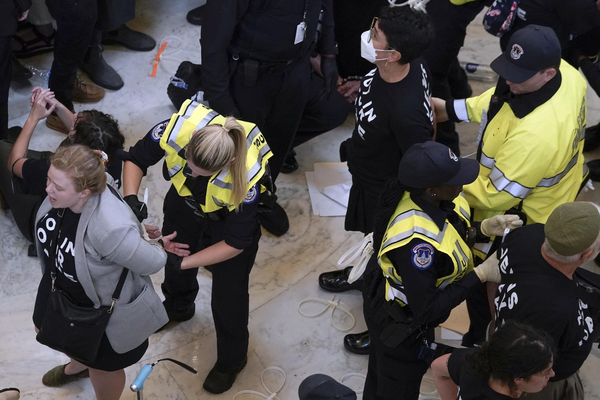 U.S. Capitol Police officers detain demonstrators protesting inside the Cannon House Office Building on Capitol Hill in Washington, Wednesday, Oct. 18, 2023. U.S. Capitol Police officers detain demonstrators protesting inside the Cannon House Office Building on Capitol Hill in Washington, Wednesday, Oct. 18, 2023. - Sputnik International, 1920, 19.10.2023
