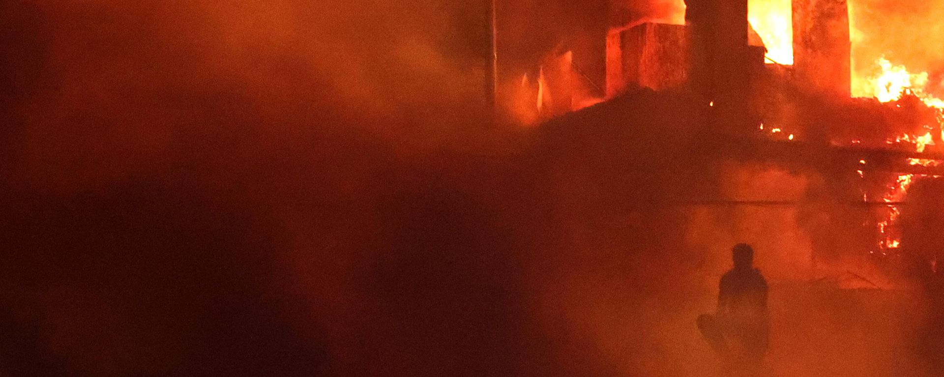 A Lebanese protester sits outside the US embassy as a fire rages behind its gates after clashes with Lebanese security forces on October 18, 2023, during a demonstration in solidarity with the people of Gaza in Awkar, East of Beirut, following a strike on a hospital in the Gaza Strip, killing at least 200 people on October 17, 2023 A Lebanese protester sits outside the US embassy as a fire rages behind its gates after clashes with Lebanese security forces on October 18, 2023, during a demonstration in solidarity with the people of Gaza in Awkar, East of Beirut, following a strike on a hospital in the Gaza Strip, killing at least 200 people on October 17, 2023 - Sputnik International, 1920, 31.10.2023