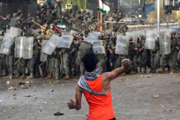 A protester throws a stone towards Lebanese army soldiers during a demonstration, in solidarity with the Palestinian people in Gaza, near the US embassy in  a northern suburb of Beirut, Lebanon, Wednesday,  - Sputnik International