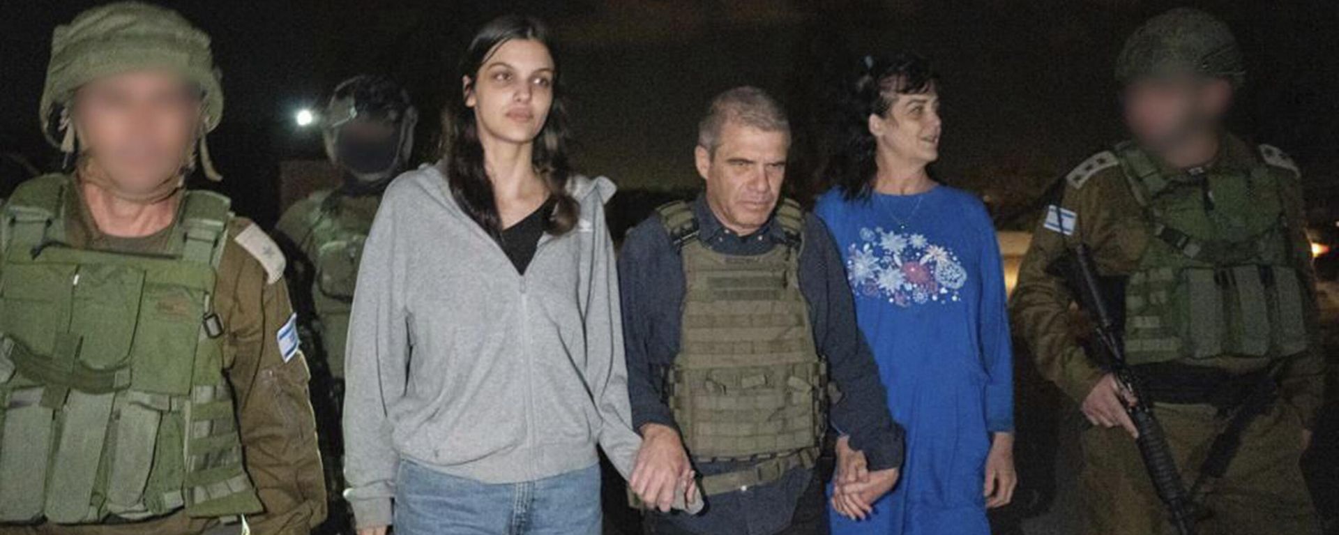 In this photo provided by the Government of Israel, Judith Raanan, right, and her 17-year-old daughter Natalie are escorted by Israeli soldiers and Gal Hirsch, Prime Minister Benjamin Netanyahu's special coordinator for returning the hostages, as they return to Israel from captivity in the Gaza Strip, Friday, Oct. 20, 2023. Hamas released the pair in what it said was a goodwill gesture late Friday, nearly two weeks after they were captured in a bloody cross-border raid by the Islamic militant group. The Hamas attack sparked a war that is entering its third week, and Hamas is believed to still be holding some 200 people hostage. In this photo provided by the Government of Israel, Judith Raanan, right, and her 17-year-old daughter Natalie are escorted by Israeli soldiers and Gal Hirsch, Prime Minister Benjamin Netanyahu's special coordinator for returning the hostages, as they return to Israel from captivity in the Gaza Strip, Friday, Oct. 20, 2023. Hamas released the pair in what it said was a goodwill gesture late Friday, nearly two weeks after they were captured in a bloody cross-border raid by the Islamic militant group. The Hamas attack sparked a war that is entering its third week, and Hamas is believed to still be holding some 200 people hostage. - Sputnik International, 1920, 21.10.2023