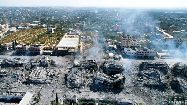 An aerial view shows destoyed buildings in al-Zahra south of Gaza City on October 20, 2023 following Israeli bombardment overnight amid ongoing battles between the IDF and the Palestinian group Hamas.  - Sputnik International