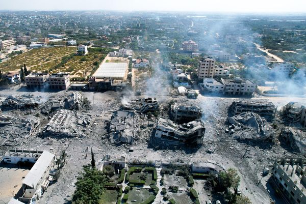 An aerial view shows destroyed buildings in al-Zahra, south of Gaza City, on October 20, 2023, following overnight Israeli bombardment amid ongoing fighting between the IDF and the Palestinian group Hamas. - Sputnik International