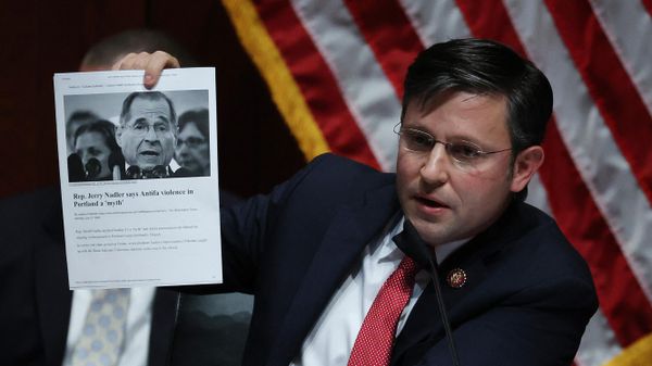 Rep. Mike Johnson (R-LA) holds up an article while questioning Attorney General William Barr before the House Judiciary Committee hearing in the Congressional Auditorium at the US Capitol Visitors Center July 28, 2020 in Washington, DC. In his first congressional testimony in more than a year, Barr is expected to face questions from the committee about his deployment of federal law enforcement agents to Portland, Oregon, and other cities in response to Black Lives Matter protests; his role in using federal agents to violently clear protesters from Lafayette Square near the White House last month before a photo opportunity for President Donald Trump in front of a church; his intervention in court cases involving Trump's allies Roger Stone and Michael Flynn; and other issues. - Sputnik International
