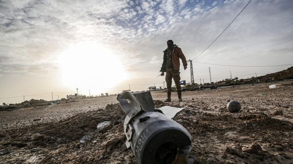A Palestinian fighter from Ezz-Al Din Al-Qassam Brigades, the armed wing of the Hamas movement, checks debris at the site of an Israeli air strike in Khan Yunis in the southern Gaza Strip December 26, 2019 - Sputnik International