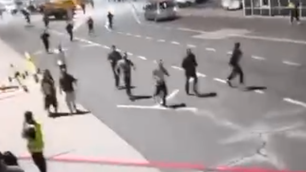 Screenshot captures moment in which trespassers swarmed an airport tarmac late Sunday in the southwestern Russian city of Makhachkala. The Russian Interior Ministry's regional office has launched a criminal probe in the matter. - Sputnik International
