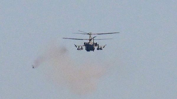 A Russian Ka-52 Alligator attack helicopter fires towards Ukrainian positions in the course of Russia's military operation in Ukraine, at the unknown location. - Sputnik International