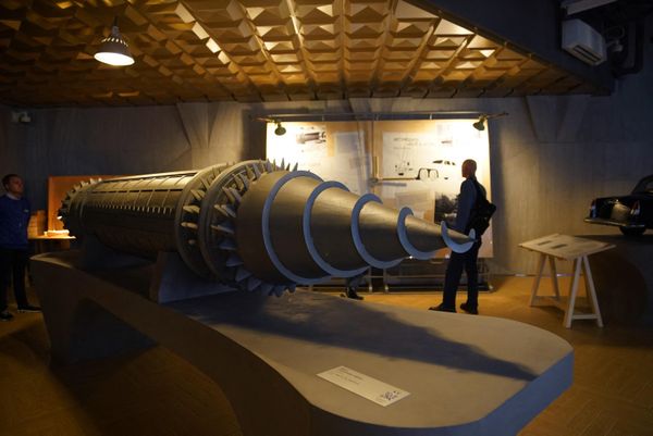 People walk past a model of the 'Subterrene', a machine for drilling and tunneling underground, as they visit the Atom pavilion, permanent center designed to demonstrate Russia's major achievements of the recent past in the nuclear power industry. - Sputnik International