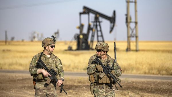 US troops patrol near an oil well in al-Qahtaniyah in Syria's northeastern Hasakah province, close to the border with Turkey, on June 14, 2023. - Sputnik International