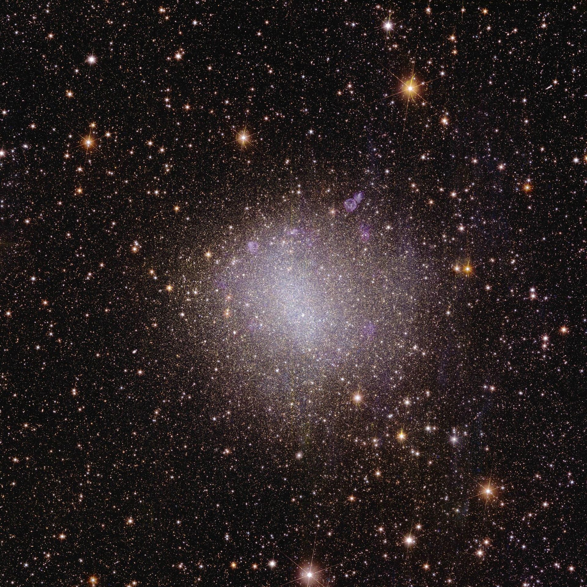 To create a 3D map of the Universe, Euclid will observe the light from galaxies out to 10 billion light-years. Most galaxies in the early Universe don’t look like the quintessential neat spiral, but are irregular and small. They are the building blocks for bigger galaxies like our own, and we can still find some of these galaxies relatively close to us. This first irregular dwarf galaxy that Euclid observed is called NGC 6822 and is located close by, just 1.6 million light-years from Earth. - Sputnik International, 1920, 07.11.2023