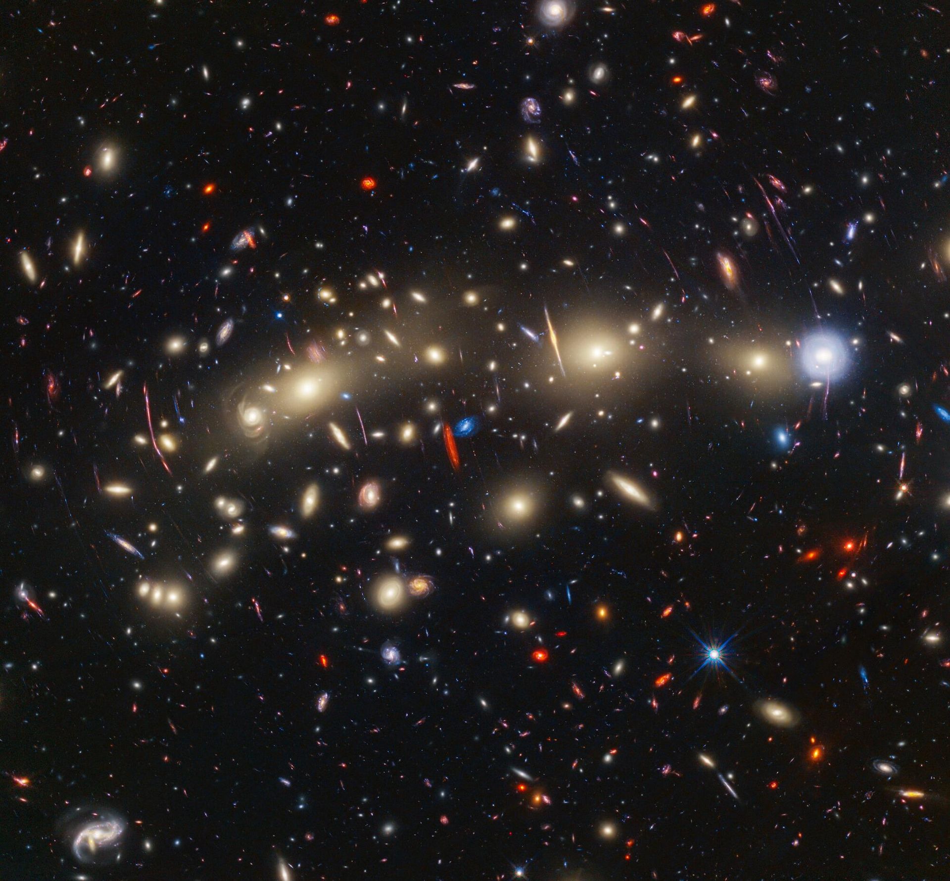 This image of galaxy cluster MACS0416 highlights one particular gravitationally lensed background galaxy, which existed about 3 billion years after the big bang. That galaxy contains a transient, or object that varies in observed brightness over time, that the science team nicknamed “Mothra.” Mothra is a star that is magnified by a factor of at least 4,000 times. The team believes that Mothra is magnified not only by the gravity of galaxy cluster MACS0416, but also by an object known as a “milli-lens” that likely weighs about as much as a globular star cluster. This image of galaxy cluster MACS0416 highlights one particular gravitationally lensed background galaxy, which existed about 3 billion years after the big bang. That galaxy contains a transient, or object that varies in observed brightness over time, that the science team nicknamed “Mothra.” Mothra is a star that is magnified by a factor of at least 4,000 times. The team believes that Mothra is magnified not only by the gravity of galaxy cluster MACS0416, but also by an object known as a “milli-lens” that likely weighs about as much as a globular star cluster. - Sputnik International, 1920, 09.11.2023