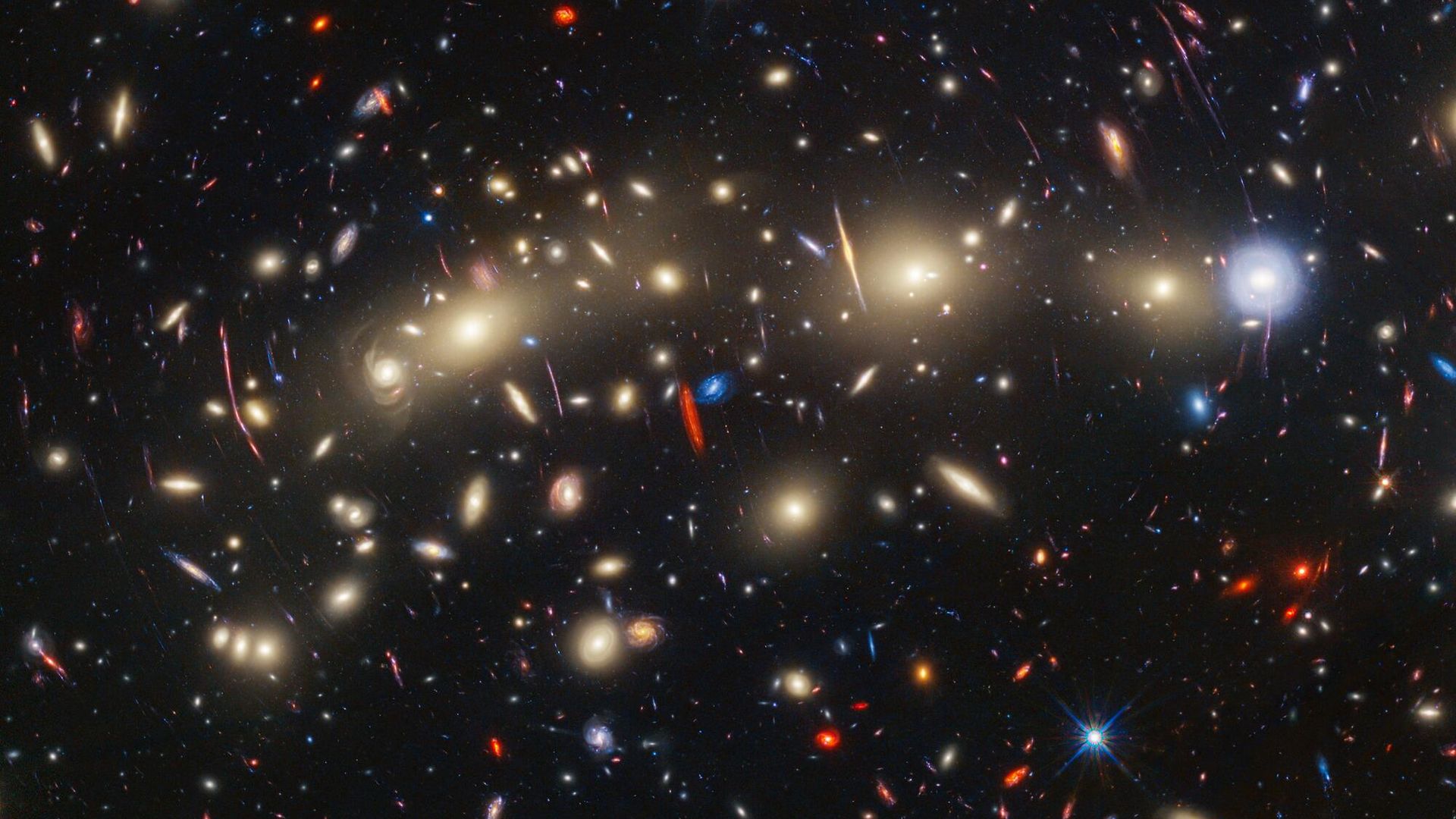 This image of galaxy cluster MACS0416 highlights one particular gravitationally lensed background galaxy, which existed about 3 billion years after the big bang. That galaxy contains a transient, or object that varies in observed brightness over time, that the science team nicknamed “Mothra.” Mothra is a star that is magnified by a factor of at least 4,000 times. The team believes that Mothra is magnified not only by the gravity of galaxy cluster MACS0416, but also by an object known as a “milli-lens” that likely weighs about as much as a globular star cluster. This image of galaxy cluster MACS0416 highlights one particular gravitationally lensed background galaxy, which existed about 3 billion years after the big bang. That galaxy contains a transient, or object that varies in observed brightness over time, that the science team nicknamed “Mothra.” Mothra is a star that is magnified by a factor of at least 4,000 times. The team believes that Mothra is magnified not only by the gravity of galaxy cluster MACS0416, but also by an object known as a “milli-lens” that likely weighs about as much as a globular star cluster. - Sputnik International, 1920, 09.11.2023