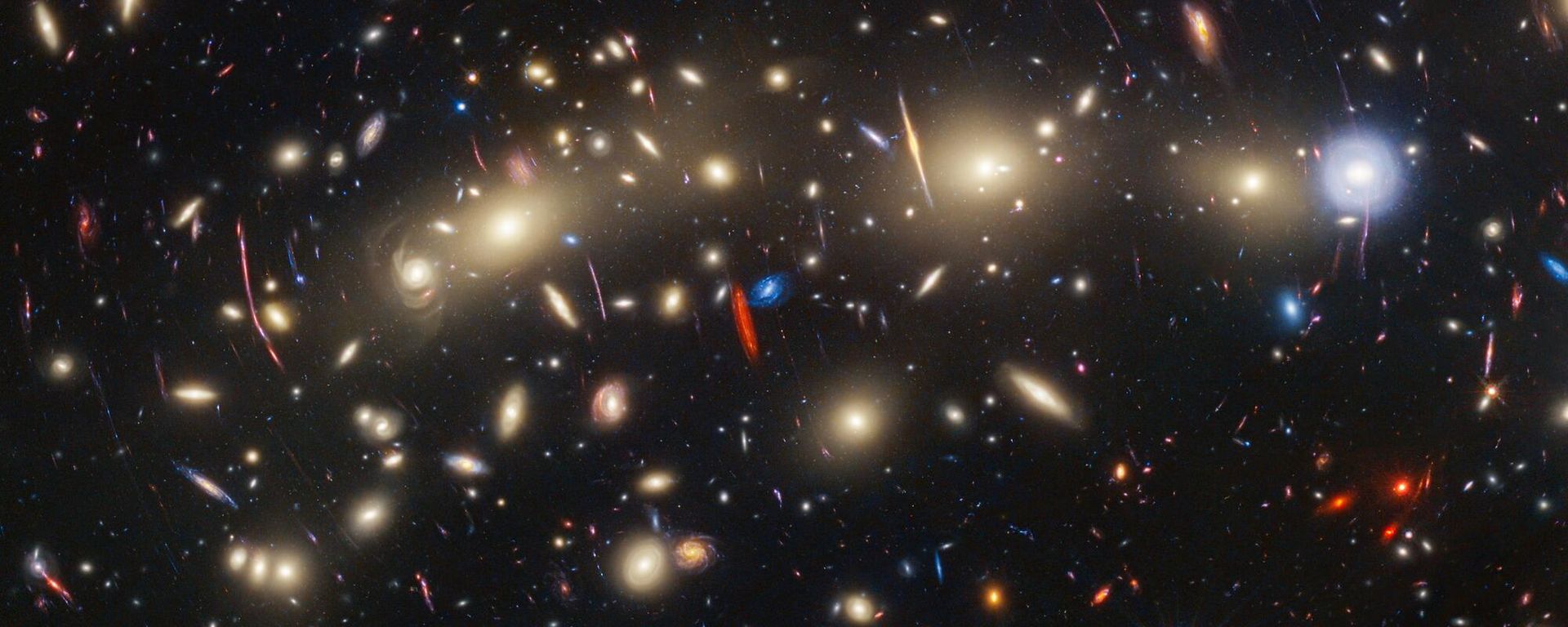 This image of galaxy cluster MACS0416 highlights one particular gravitationally lensed background galaxy, which existed about 3 billion years after the big bang. That galaxy contains a transient, or object that varies in observed brightness over time, that the science team nicknamed “Mothra.” Mothra is a star that is magnified by a factor of at least 4,000 times. The team believes that Mothra is magnified not only by the gravity of galaxy cluster MACS0416, but also by an object known as a “milli-lens” that likely weighs about as much as a globular star cluster. This image of galaxy cluster MACS0416 highlights one particular gravitationally lensed background galaxy, which existed about 3 billion years after the big bang. That galaxy contains a transient, or object that varies in observed brightness over time, that the science team nicknamed “Mothra.” Mothra is a star that is magnified by a factor of at least 4,000 times. The team believes that Mothra is magnified not only by the gravity of galaxy cluster MACS0416, but also by an object known as a “milli-lens” that likely weighs about as much as a globular star cluster. - Sputnik International, 1920, 09.11.2023