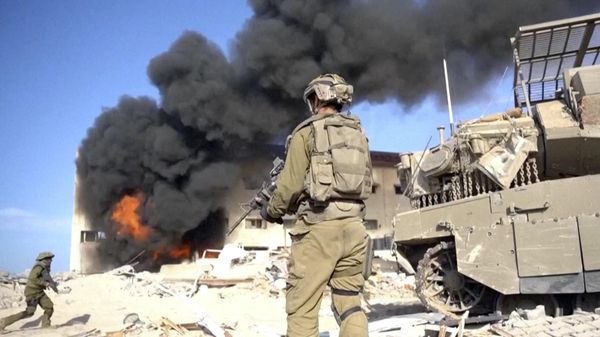 In this image taken from a video released by the Israel Defense Forces on Tuesday, Nov. 14, 2023, an Israeli soldier holds a weapon in Gaza City. - Sputnik International
