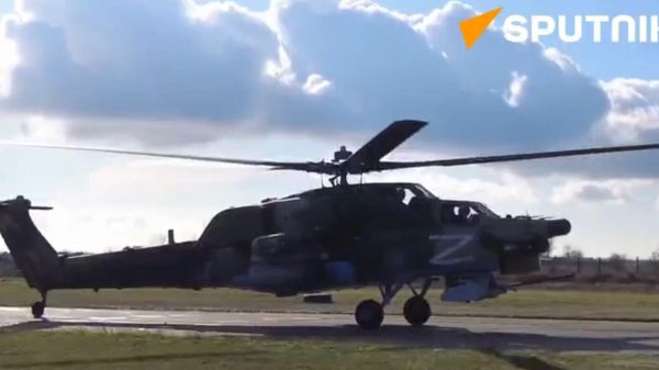 The crews of Russian Mi-28N attack helicopters destroyed Ukrainian strongholds and armored vehicles in the Donetsk direction - Sputnik International