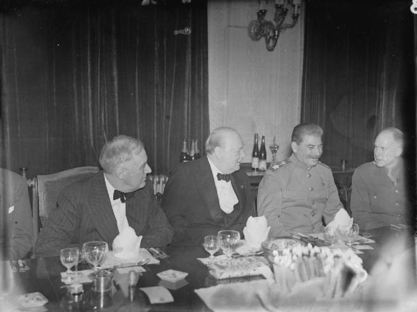 The “Big Three,” Franklin D Roosevelt (US), Winston Churchill (UK), and Joseph Stalin (USSR), sit together at Winston Churchill's 69th birthday party, held in the Victorian Drawing Room at the British Embassy in Tehran, Iran (November 30, 1943). - Sputnik International