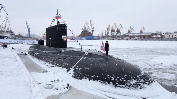 A serviceman attends a ceremony to raise the Russian Navy ensign aboard the Project 636.3 diesel-electric submarine Mozhaisk joining the Russian Pacific Fleet at Admiralty Shipyards, a subsidiary of the United Shipbuilding Corporation, in St. Petersburg, Russia - Sputnik International