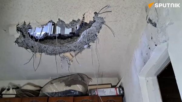 One of the Grad shells fired by Ukrainian forces pierced the roof of a residential building in Donetsk. As a result of the Ukrainian strike on the Azotny microdistrict, five people were wounded - Sputnik International