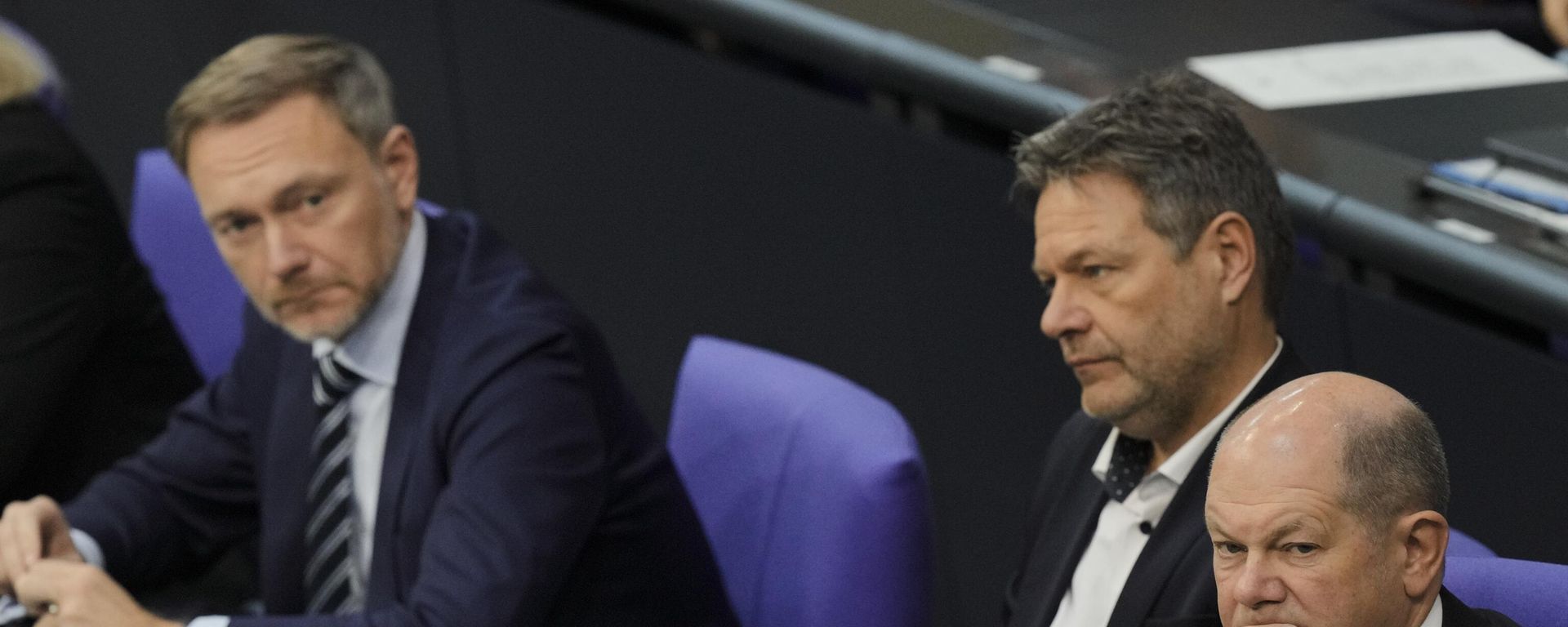From right, German Chancellor Olaf Scholz, Economy and Climate Minister Robert Habeck and Finance Minister Christian Lindner listen to a debate about Germany's budget crisis at the parliament Bundestag in Berlin, Germany, Tuesday, Nov. 28, 2023. - Sputnik International, 1920, 10.11.2024