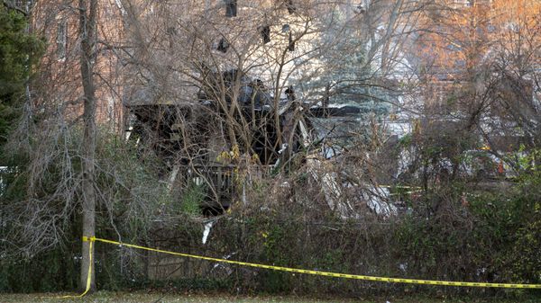 Debris hangs in the trees near the remains of a home after an explosion on Tuesday, Dec. 5, 2023, in Arlington, Va.  - Sputnik International