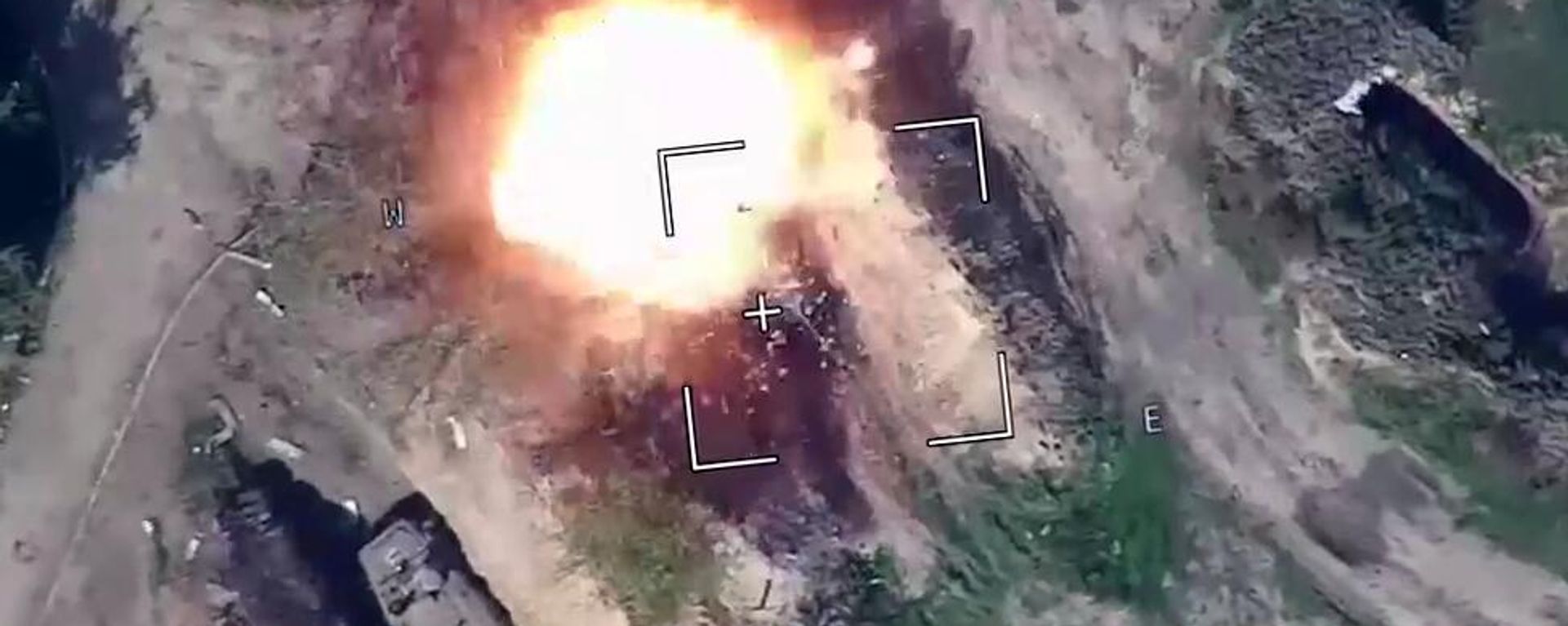 In this handout video grab taken from footage released by the Russian Defence Ministry, a view shows air strikes carried out by Russia's self-destructing suicide drone Lancet hitting, according to the ministry, vehicles of Ukrainian troops in the course of Russia's military operation in Ukraine, at the unknown location.  - Sputnik International, 1920, 25.07.2025