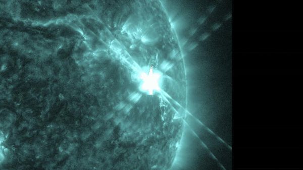 This photo provided by NASA’s Solar Dynamics Observatory captured this image of a solar flare, as seen in the bright flash in the upper right, on Thursday, Dec. 14, 2023.  - Sputnik International