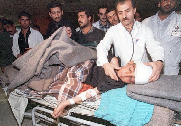 An Iraqi doctor checks an injured boy in a shelter at Baghdad's Saddam Medical Center after an air raid late on December 17. After the raid, at least five missiles fell on residential and administrative districts in the capital. A general hospital and a maternity hospital were reported to have been hit. - Sputnik International