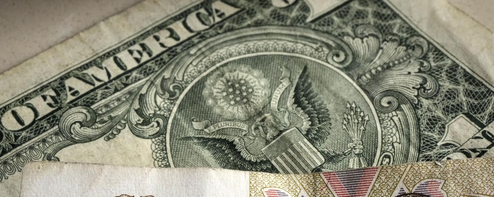 One hundred rubles banknote is pictured in front of a one US dollar banknote, Gelsenkirchen, Germany, Monday, April 25, 2022.  - Sputnik International, 1920, 14.02.2024