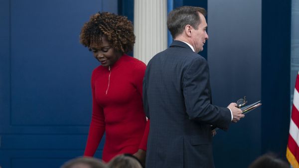 National Security Council spokesman John Kirby walks past White House press secretary Karine Jean-Pierre - Sputnik International