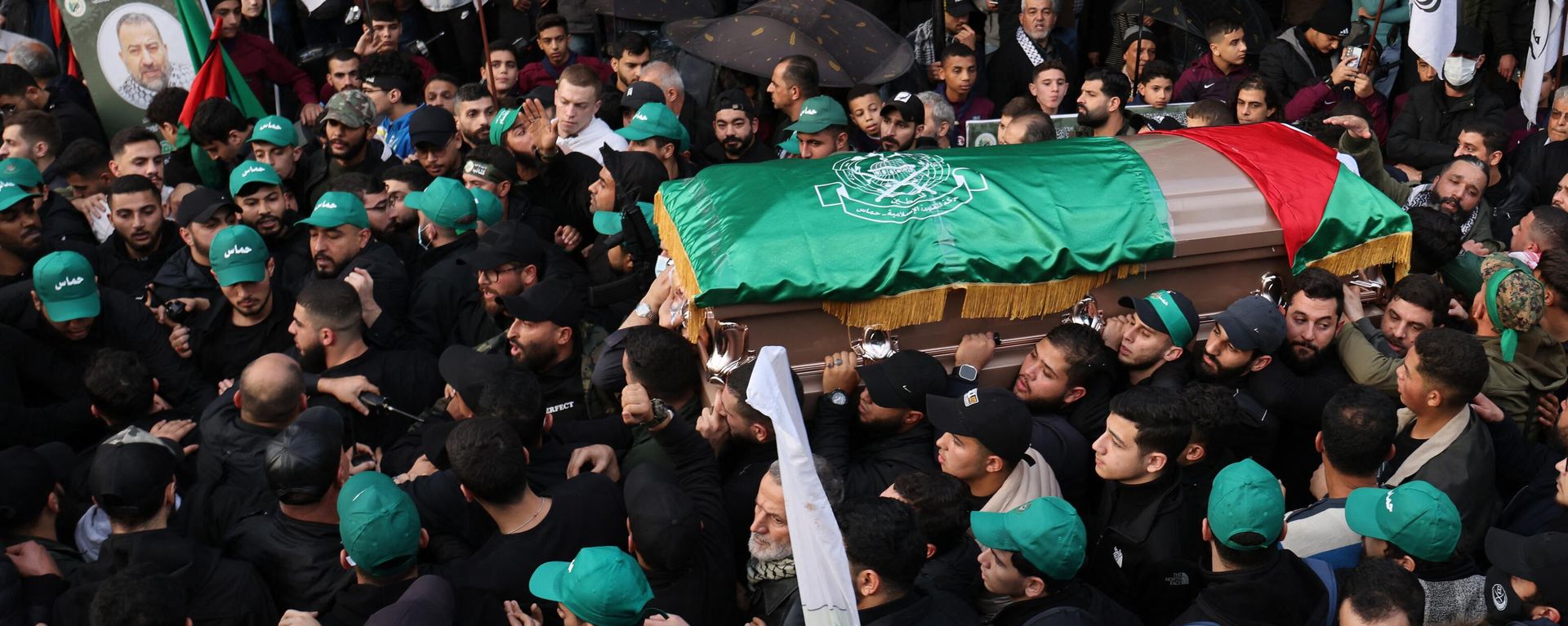 Mourners carry the coffin of Hamas' deputy leader, Saleh al-Aruri (portrait-R), killed on January 2 in a strike in Beirut's southern suburbs, during his funeral procession in Lebanon's capital on January 4. Lebanese authorities and Hamas accused Israel of killing Hamas leader al-Aruri and other officials, with Lebanese state media saying they died in a drone strike. Mourners carry the coffin of Hamas' deputy leader, Saleh al-Aruri (portrait-R), killed on January 2 in a strike in Beirut's southern suburbs, during his funeral procession in Lebanon's capital on January 4. Lebanese authorities and Hamas accused Israel of killing Hamas leader al-Aruri and other officials, with Lebanese state media saying they died in a drone strike. - Sputnik International, 1920, 07.01.2024