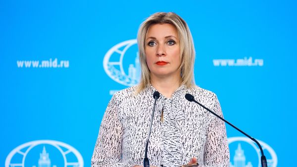 In this handout photo released by the Russian Foreign Ministry, Russian Foreign Ministry’s spokeswoman Maria Zakharova attends her weekly briefing in Moscow, Russia - Sputnik International
