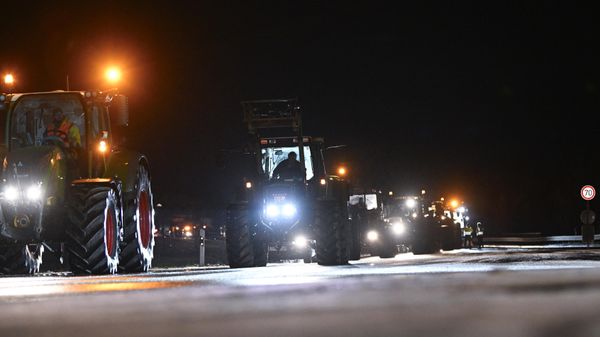 Farmers are seen next to their tractors on a road as they demonstrate against the federal government's austerity plans, in Ludwigsburg, southern Germany on January 8, 2024.  - Sputnik International