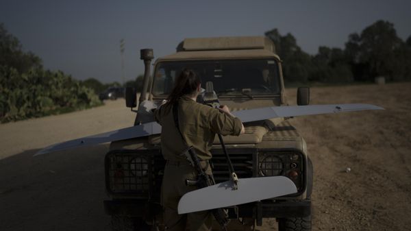 An Israeli soldier checks a reconnaissance drone to ensure it's in working order somewhere near the Israel-Gaza border, January 2024. - Sputnik International