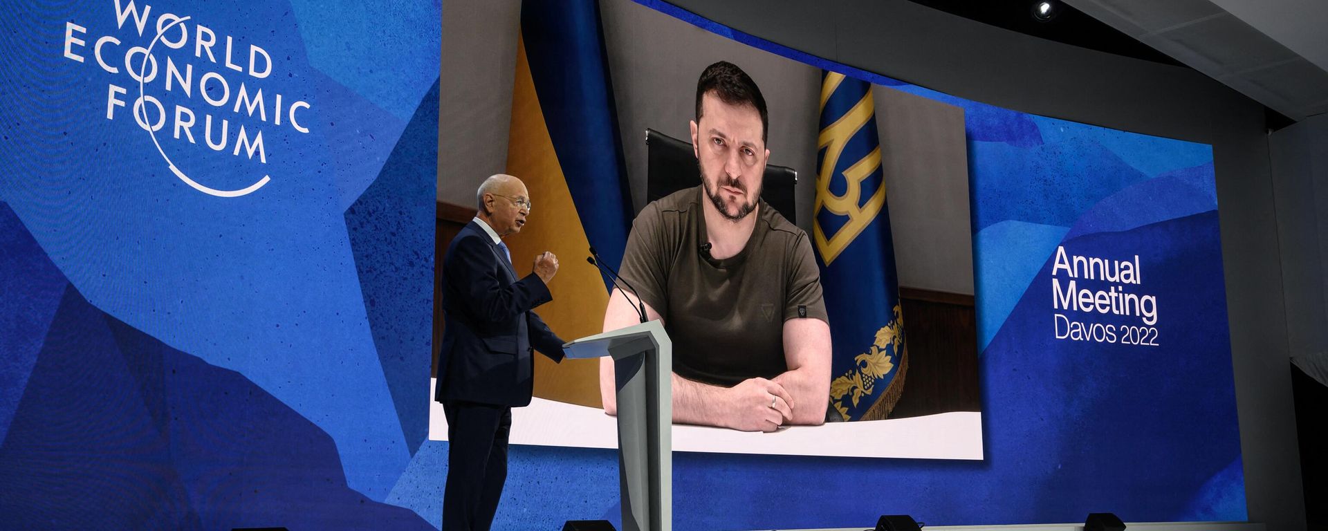 Founder and executive chairman of the World Economic Forum Klaus Schwab welcomes Ukrainian President Volodymyr Zelensky seen on a giant screen by video link at the Congress centre during the World Economic Forum (WEF) annual meeting in Davos on May 23, 2022. Zelensky is similarly expected to attend the WEF's 2024 meetings this week. Founder and executive chairman of the World Economic Forum Klaus Schwab welcomes Ukrainian President Volodymyr Zelensky seen on a giant screen by video link at the Congress centre during the World Economic Forum (WEF) annual meeting in Davos on May 23, 2022. Zelensky is similarly expected to attend the WEF's 2024 meetings this week. - Sputnik International, 1920, 15.01.2024