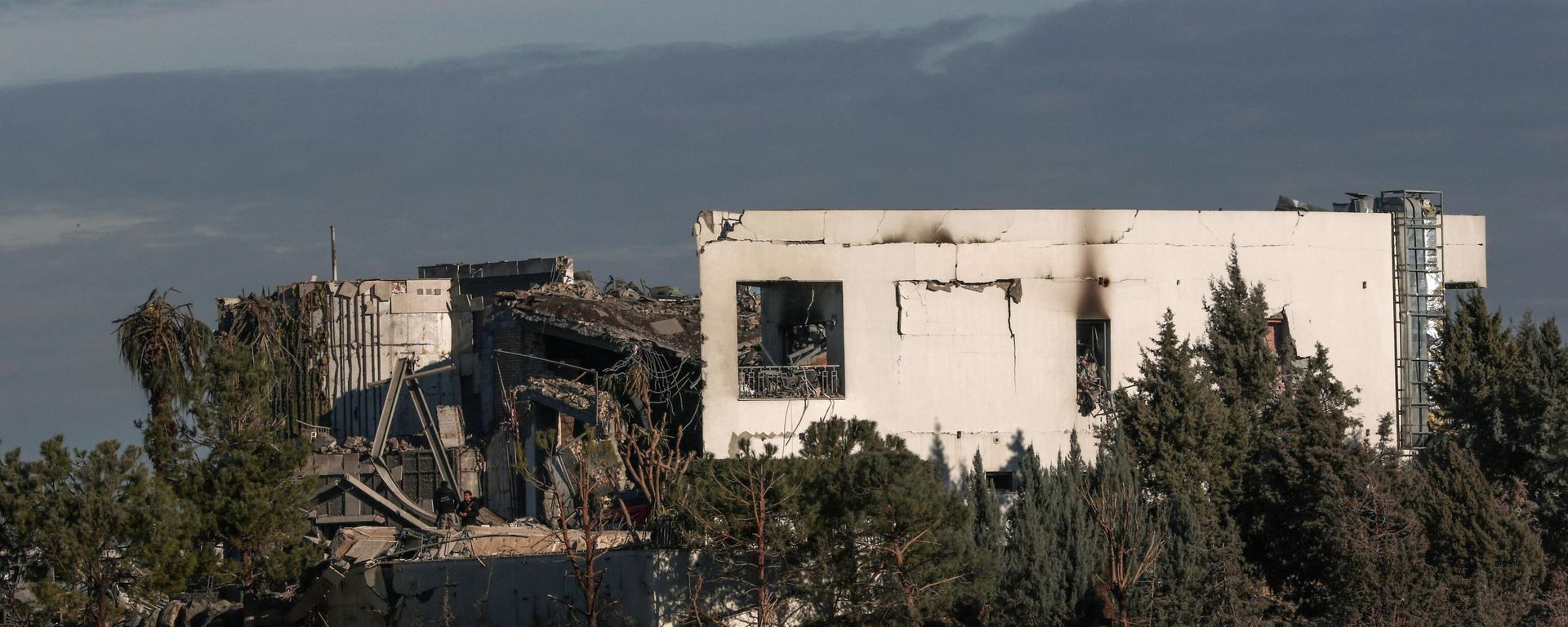 A picture shows a view of a damaged building following a missile strike. A picture shows a view of a damaged building following a missile strike. - Sputnik International, 1920, 16.01.2024