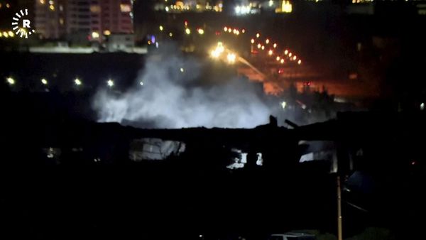 This image taken from video provided by Rudaw TV shows smoke rising from a building hit by a strike in Erbil, Iraq. - Sputnik International