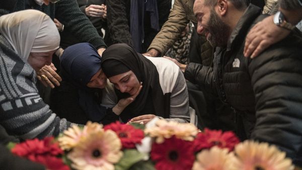 Women console the mother (C) of 17-year-old Palestinian Tawfeek Ajaq, who, according to reports holds a US citizenship, killed a day earlier in the village of Al-Mazraa Al-Sharqiya in the Israeli-occupied West Bank - Sputnik International